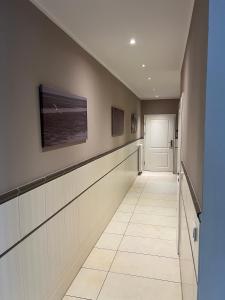 a long hallway with a hallway at Seestern - Whg 2 in Wyk auf Föhr