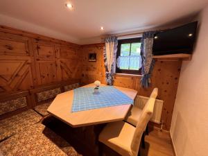 a dining room with a table and chairs and a window at Chalet Hannelore-3 by Interhome in Sölden