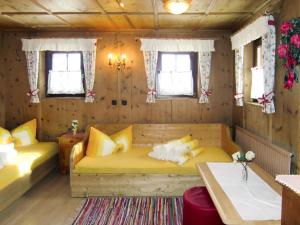 a room with two beds in a wooden house at Chalet Hannelore-3 by Interhome in Sölden