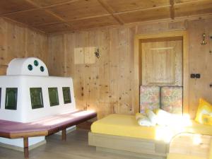 a room with two beds and a toy stove at Chalet Hannelore-3 by Interhome in Sölden +36 photos