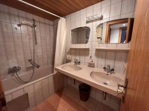a bathroom with a sink and a shower and a mirror at Chalet Hannelore-3 by Interhome in Sölden +36 photos