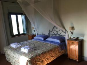 Postel nebo postele na pokoji v ubytování Agriturismo Podere Marchiano + 37 fotografií