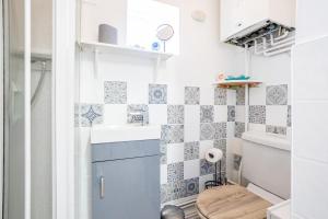 a small bathroom with a sink and a toilet at 3 Bedrooms & 2 Showers - Home From Home in Newcastle under Lyme