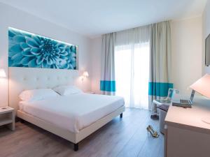 Postel nebo postele na pokoji v ubytování ibis Styles Milano Est Settala + 37 fotografií