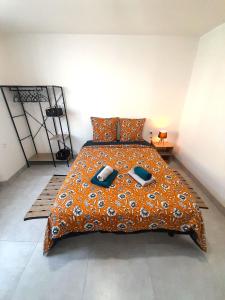 a bedroom with a large bed with two pillows at Élégant appartement Vatan centre in Vatan