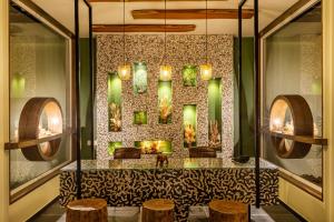 a lobby with a fireplace and some stools at Sterling Tipeshwar in Pahāpal