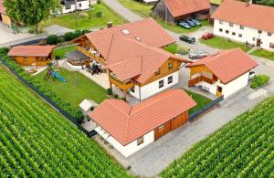 an aerial view of a house with orange roof at Ferienwohnung "Familienglück" in Achslach