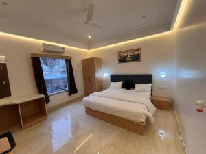 Postel nebo postele na pokoji v ubytování Hotel Dhanraj Inn + 12 fotografií