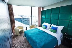 Tempat tidur dalam kamar di SONO hotel