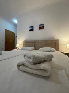 Postel nebo postele na pokoji v ubytování Tasos Rooms