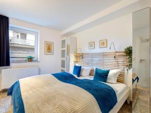 Кровать или кровати в номере Ostseeresidenz Gorki Park GP 07A mit Wellness und Schwimmbad +15 фотографий