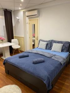 Postel nebo postele na pokoji v ubytování Malasits Apartman