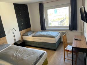 Katil atau katil-katil dalam bilik di Salzgitter Home