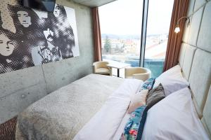 Tempat tidur dalam kamar di SONO hotel