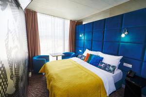 Tempat tidur dalam kamar di SONO hotel