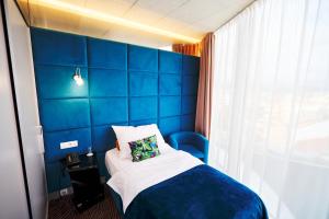 Tempat tidur dalam kamar di SONO hotel