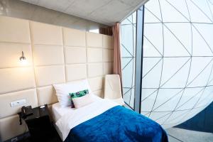 Tempat tidur dalam kamar di SONO hotel