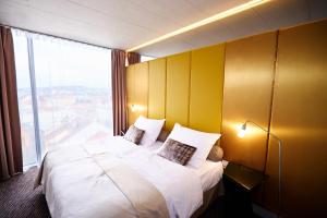 Tempat tidur dalam kamar di SONO hotel