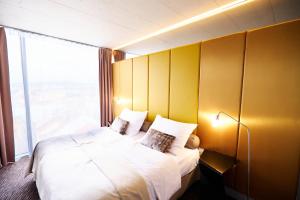 Tempat tidur dalam kamar di SONO hotel