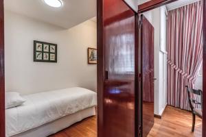 Ένα ή περισσότερα κρεβάτια σε δωμάτιο στο Domus in Via Del Corso