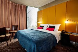 Tempat tidur dalam kamar di SONO hotel