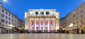 a large building in the middle of two buildings at SV - Au Pied du Vieux Port in Marseille