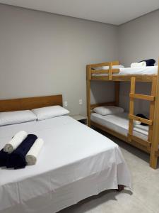 a bedroom with two bunk beds and a ladder at Aconchego Fabuloso in Penedo +61 photos