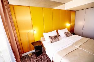 Tempat tidur dalam kamar di SONO hotel