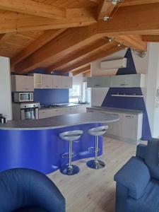 Kuchyň nebo kuchyňský kout v ubytování B&B " Guzzi - Inn "