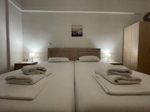 Postel nebo postele na pokoji v ubytování Tasos Rooms