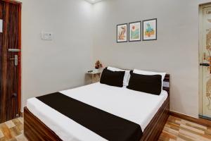 Postel nebo postele na pokoji v ubytování Super Hotel O Choolai Near Chennai Railway Station