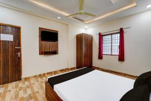 Postel nebo postele na pokoji v ubytování Super Hotel O Choolai Near Chennai Railway Station