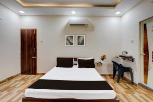 Postel nebo postele na pokoji v ubytování Super Hotel O Choolai Near Chennai Railway Station