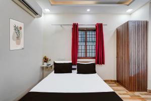 Postel nebo postele na pokoji v ubytování Super Hotel O Choolai Near Chennai Railway Station
