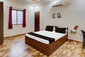 Postel nebo postele na pokoji v ubytování Super Hotel O Choolai Near Chennai Railway Station