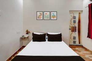 Postel nebo postele na pokoji v ubytování Super Hotel O Choolai Near Chennai Railway Station