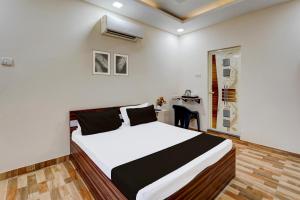 Postel nebo postele na pokoji v ubytování Super Hotel O Choolai Near Chennai Railway Station
