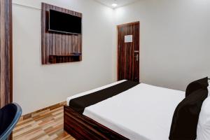 Postel nebo postele na pokoji v ubytování Super Hotel O Choolai Near Chennai Railway Station