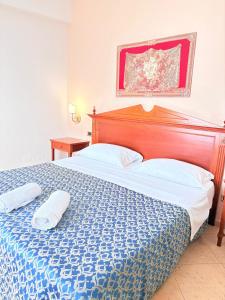 Postel nebo postele na pokoji v ubytování D'Angelo Palace Hotel