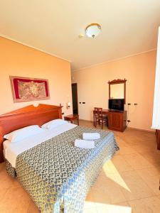 Postel nebo postele na pokoji v ubytování D'Angelo Palace Hotel
