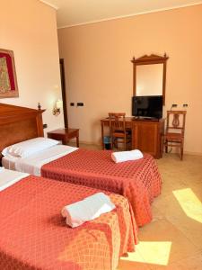 Postel nebo postele na pokoji v ubytování D'Angelo Palace Hotel