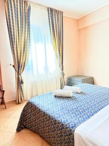 Postel nebo postele na pokoji v ubytování D'Angelo Palace Hotel