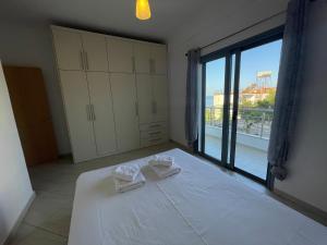 Postel nebo postele na pokoji v ubytování Tasos Rooms