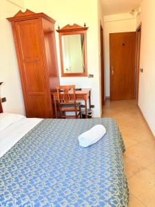 Postel nebo postele na pokoji v ubytování D'Angelo Palace Hotel
