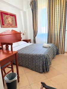 Postel nebo postele na pokoji v ubytování D'Angelo Palace Hotel