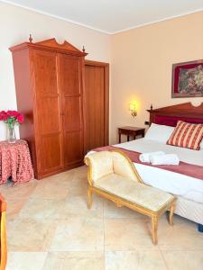 Postel nebo postele na pokoji v ubytování D'Angelo Palace Hotel