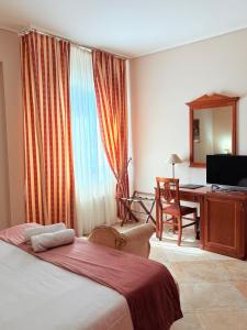 Postel nebo postele na pokoji v ubytování D'Angelo Palace Hotel