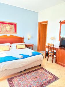 Postel nebo postele na pokoji v ubytování D'Angelo Palace Hotel
