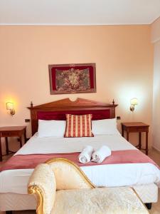 Postel nebo postele na pokoji v ubytování D'Angelo Palace Hotel