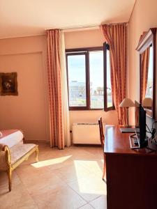 Postel nebo postele na pokoji v ubytování D'Angelo Palace Hotel